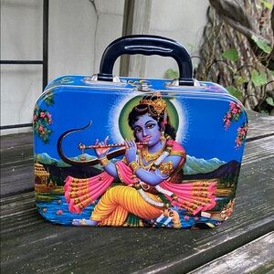 Metal lunch box. Krishna, Ganesha, Lakshmi and Saraswati.